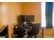 Bright office space with a desk, comfortable chair, and a view to the outside at 106 Gwenellen Dr, Locust Grove, GA 30248