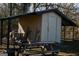 A sturdy outdoor storage shed offers ample space for tools, equipment, and recreational gear, enhancing the property's functionality at 106 Gwenellen Dr, Locust Grove, GA 30248