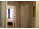Hallway with view to bedroom featuring a bed and black curtains at 106 Gwenellen Dr, Locust Grove, GA 30248