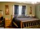 Serene bedroom with a comfortable bed, soft lighting, and ample space for relaxation at 106 Gwenellen Dr, Locust Grove, GA 30248