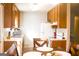 Bright kitchen features wood cabinets, white appliances and plenty of counter space at 106 Gwenellen Dr, Locust Grove, GA 30248