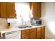 Well-lit kitchen showcasing stainless steel sink and microwave at 106 Gwenellen Dr, Locust Grove, GA 30248