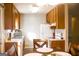 Kitchen with wood cabinets, white appliances and laminate countertops at 106 Gwenellen Dr, Locust Grove, GA 30248