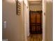 Hallway with an antique-style wooden cabinet with ample storage space, adding character to the home at 106 Gwenellen Dr, Locust Grove, GA 30248