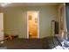 View from bedroom to bathroom featuring a toilet and shower with framed artwork at 106 Gwenellen Dr, Locust Grove, GA 30248