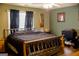 Serene bedroom with a comfortable bed, soft lighting, and ample space for relaxation at 106 Gwenellen Dr, Locust Grove, GA 30248