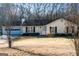 Charming single-story home featuring an attached garage and cozy front yard at 106 Gwenellen Dr, Locust Grove, GA 30248