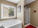 Bathroom with a bathtub and shower at 7356 Blue Jay Way, Union City, GA 30291