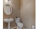 Clean bathroom with pedestal sink and toilet at 7356 Blue Jay Way, Union City, GA 30291