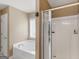 Bathroom features a bathtub and shower at 7356 Blue Jay Way, Union City, GA 30291
