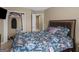 Bedroom with floral bedding and closet at 7356 Blue Jay Way, Union City, GA 30291