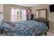 Bedroom with floral bedding and dresser at 7356 Blue Jay Way, Union City, GA 30291