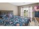 Bedroom with floral bedding and dresser at 7356 Blue Jay Way, Union City, GA 30291