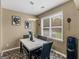 Bright dining area with a marble table and black leather chairs at 7356 Blue Jay Way, Union City, GA 30291