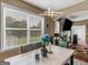 Dining area with a marble table, black chairs, and a view of the backyard at 7356 Blue Jay Way, Union City, GA 30291