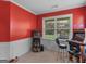 Game room with arcade games, a large window, and red walls at 7356 Blue Jay Way, Union City, GA 30291