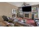 Gathering room with fireplace, large TV, and comfy seating at 7356 Blue Jay Way, Union City, GA 30291