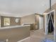 Upper hallway with carpet, hanging chair, and access to rooms at 7356 Blue Jay Way, Union City, GA 30291