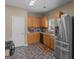 Kitchen with stainless steel appliances and ample wood cabinets at 7356 Blue Jay Way, Union City, GA 30291