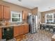 Kitchen with stainless steel appliances and a view of the dining area at 7356 Blue Jay Way, Union City, GA 30291