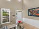 Living room with high ceilings, hardwood floors, and entryway at 7356 Blue Jay Way, Union City, GA 30291