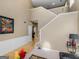 Living room with high ceilings, hardwood floors, and staircase at 7356 Blue Jay Way, Union City, GA 30291