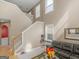 Living area with high ceilings, hardwood floors, and staircase at 7356 Blue Jay Way, Union City, GA 30291