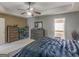 Main bedroom with a king-size bed, dresser, and access to bathroom at 7356 Blue Jay Way, Union City, GA 30291