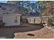 Large backyard with a wooden fence and retaining walls at 901 Arbor Way, Mcdonough, GA 30253