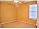 Simple bedroom with ceiling fan and window at 901 Arbor Way, Mcdonough, GA 30253