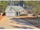 Brick house with attached garage and landscaping at 901 Arbor Way, Mcdonough, GA 30253