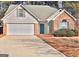 Brick and vinyl siding house with a two-car garage at 901 Arbor Way, Mcdonough, GA 30253
