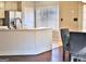 Kitchen features a large island, stainless steel appliances, and hardwood floors at 901 Arbor Way, Mcdonough, GA 30253