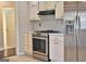 Kitchen with stainless steel appliances and white cabinets at 901 Arbor Way, Mcdonough, GA 30253