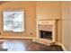 Living room with brick fireplace and hardwood floors at 901 Arbor Way, Mcdonough, GA 30253