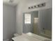 Bathroom with a large mirror, tub/shower combination and good lighting at 9418 Sleepy Hollow Ln, Jonesboro, GA 30238