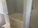 Bathroom with bathtub and shower at 9418 Sleepy Hollow Ln, Jonesboro, GA 30238