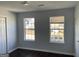 This bedroom features fresh paint, wood-look floors and bright, natural light at 9418 Sleepy Hollow Ln, Jonesboro, GA 30238