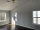 Bright bedroom with hardwood floors and multiple windows at 9418 Sleepy Hollow Ln, Jonesboro, GA 30238