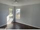 Bright bedroom with hardwood floors and multiple windows at 9418 Sleepy Hollow Ln, Jonesboro, GA 30238