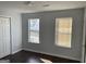 Bright bedroom with hardwood floors and window at 9418 Sleepy Hollow Ln, Jonesboro, GA 30238