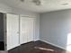 Bedroom with hardwood floors and double door closet at 9418 Sleepy Hollow Ln, Jonesboro, GA 30238