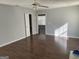Simple bedroom with hardwood floors and access to bathroom at 9418 Sleepy Hollow Ln, Jonesboro, GA 30238