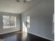 Bright bedroom with hardwood floors and multiple windows at 9418 Sleepy Hollow Ln, Jonesboro, GA 30238