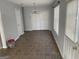 Simple dining area with tile floors and double doors at 9418 Sleepy Hollow Ln, Jonesboro, GA 30238