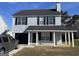 Two-story house with gray siding, a covered porch, and a attached garage at 9418 Sleepy Hollow Ln, Jonesboro, GA 30238