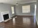 Spacious living room with hardwood floors and fireplace at 9418 Sleepy Hollow Ln, Jonesboro, GA 30238