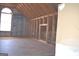 Unfinished attic features a partially framed wall and a bright window at 213 Meridian Dr, Stockbridge, GA 30281