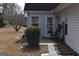 A back patio features metal outdoor furniture and garden at 213 Meridian Dr, Stockbridge, GA 30281