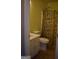 Cozy bathroom with a decorative shower curtain, a single sink vanity and neutral tile floors at 213 Meridian Dr, Stockbridge, GA 30281